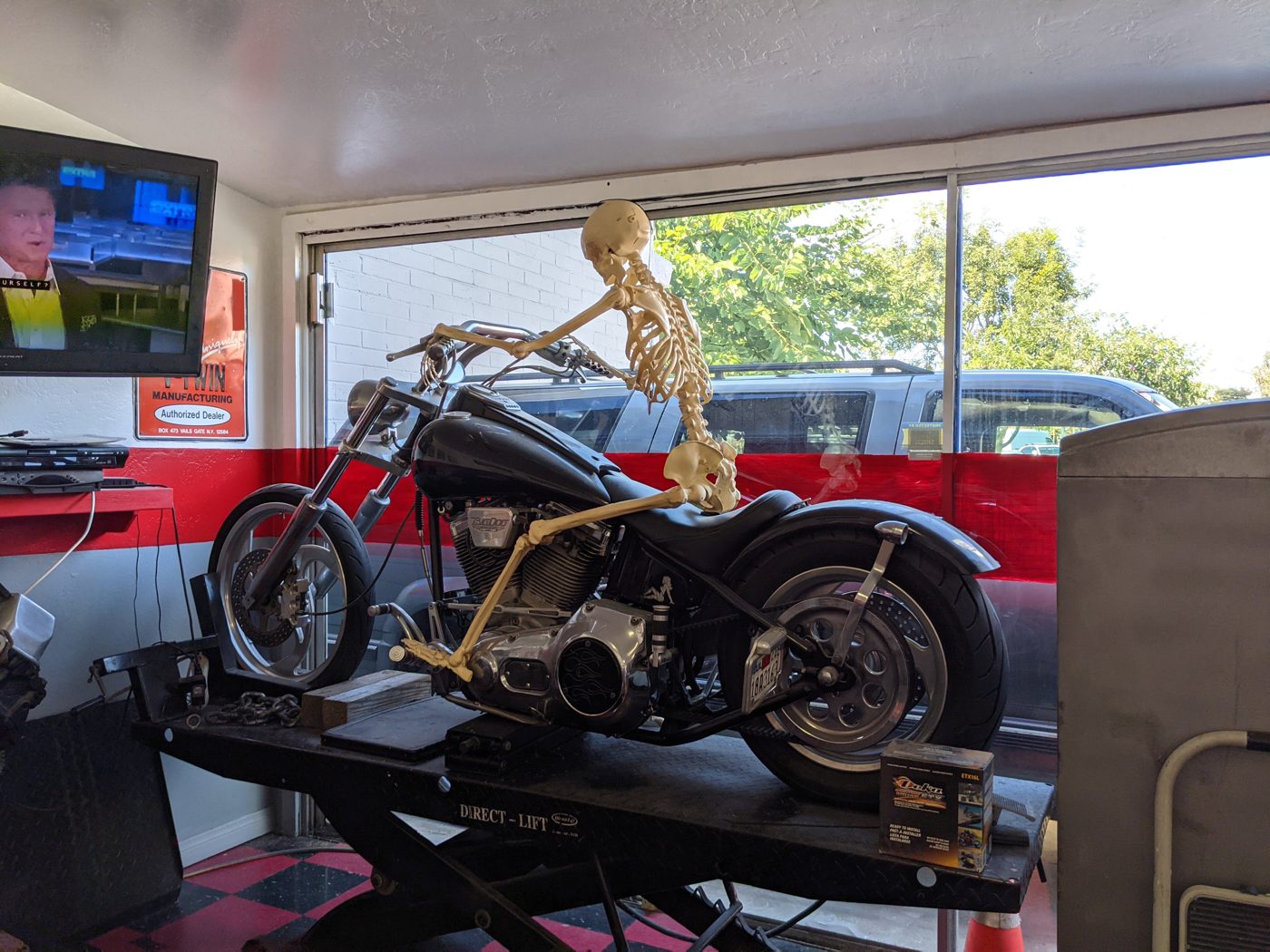 Motorcycle on the lift inside the shop